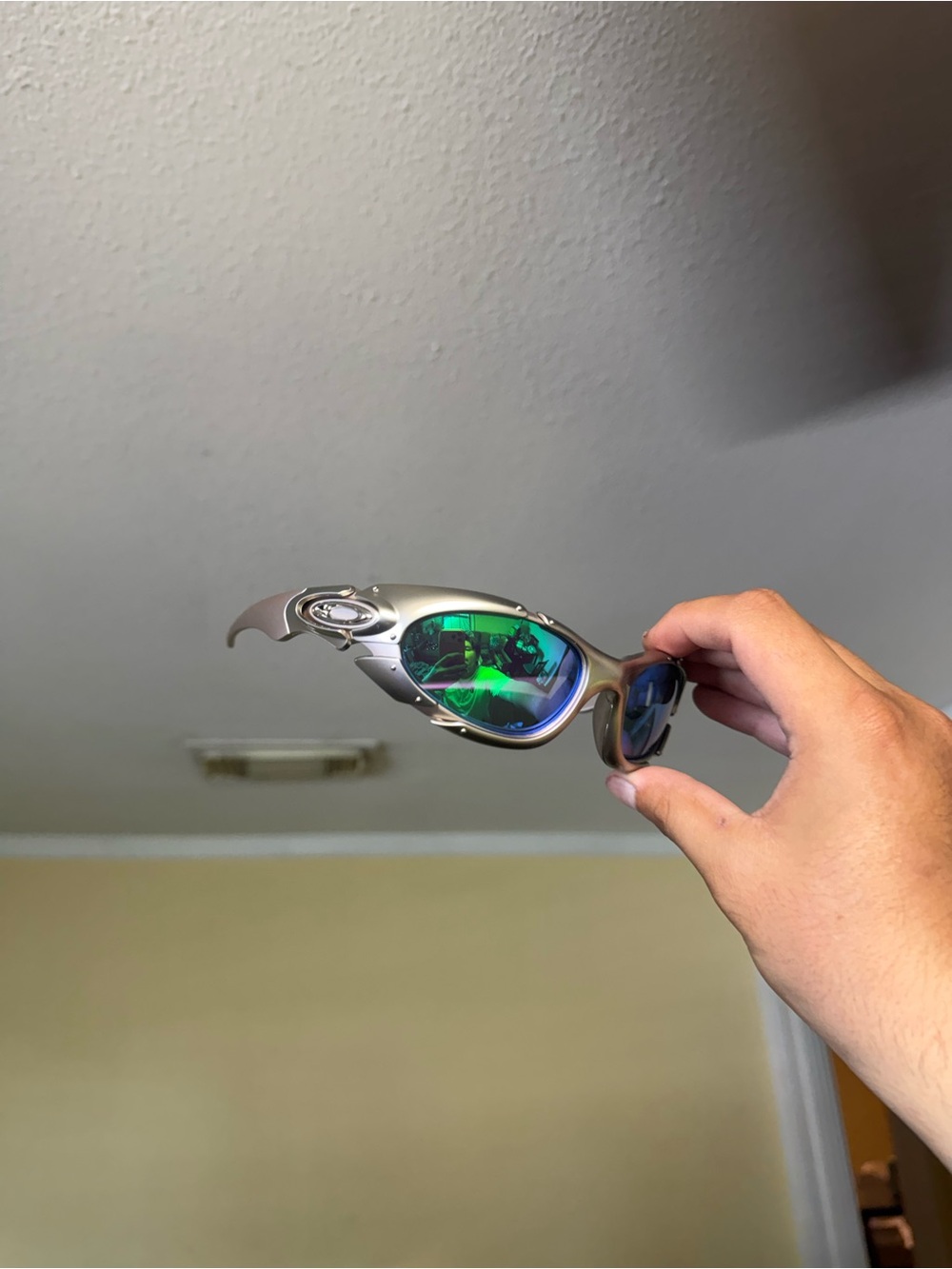 Oakley Silver Frame Sunglasses with Green Mirrored Lenses Oakley